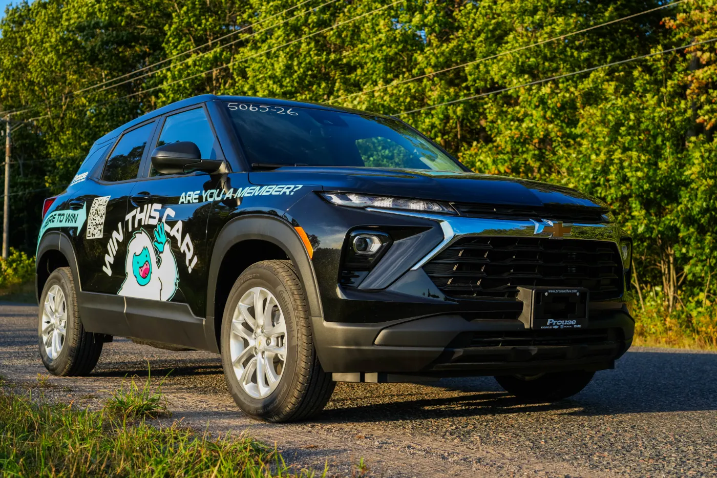 Side profile of the wrapped Trailblazer out on the road